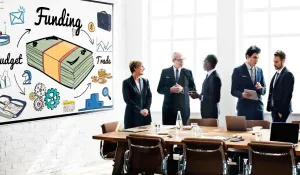  People talking in a Business meeting on funding strategy.